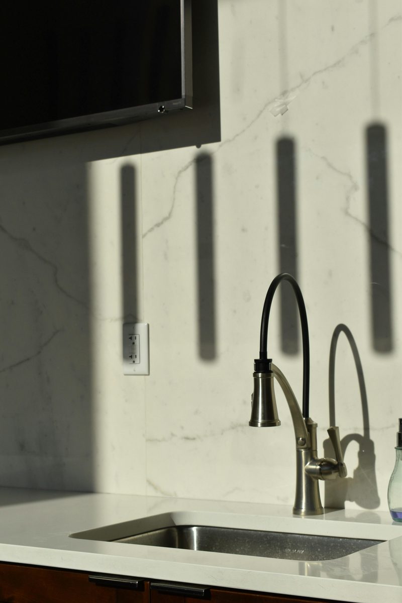 Kitchen with modern sink and wood cabinets